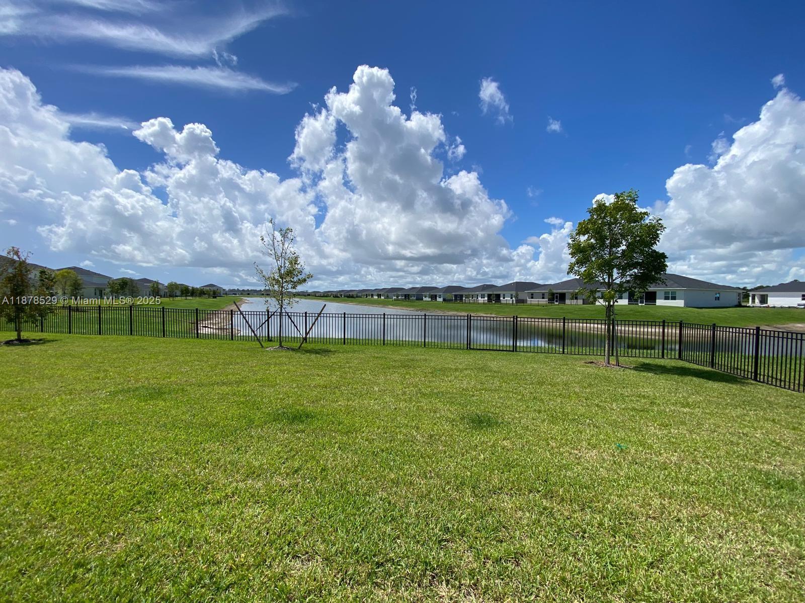 11060 Middle Strm Drive Port St. Lucie, FL 34987 - Photo 4 of 41 a view of a golf course with a lake