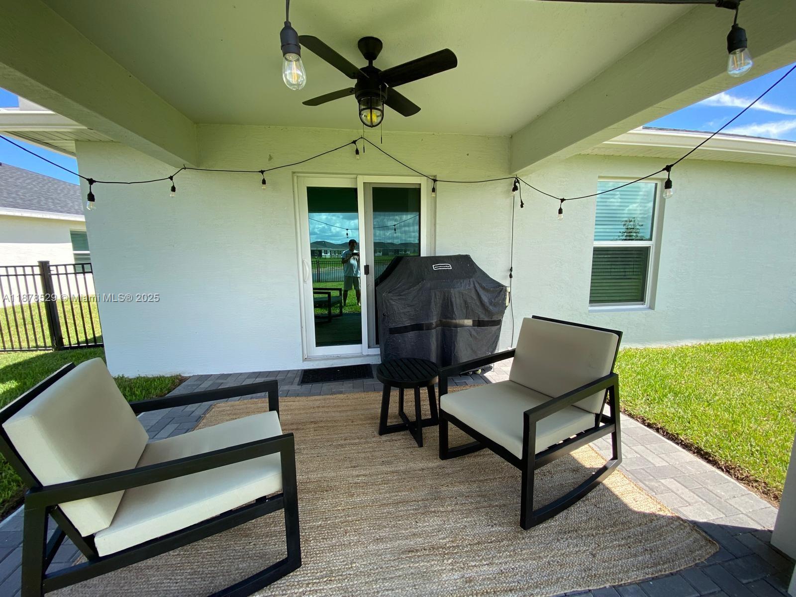 11060 Middle Strm Drive Port St. Lucie, FL 34987 - Photo 5 of 41 a living room with furniture and a rug