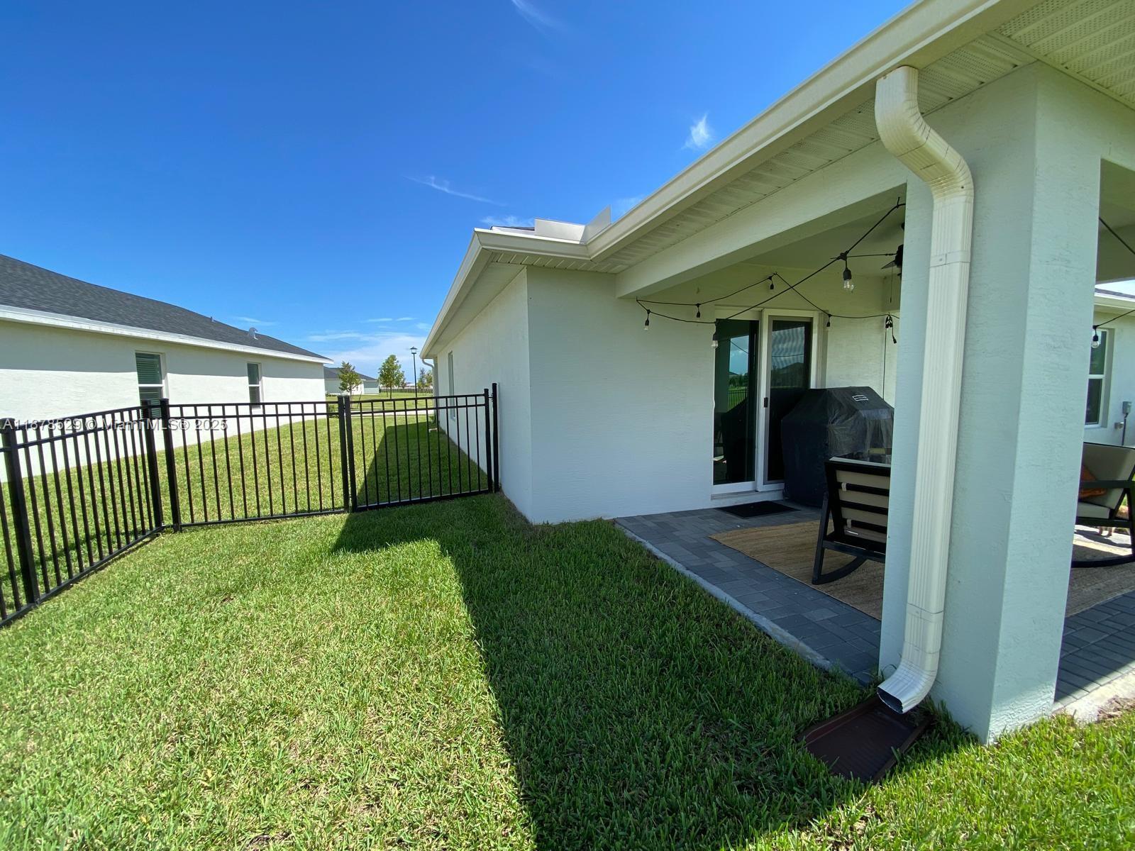 11060 Middle Strm Drive Port St. Lucie, FL 34987 - Photo 8 of 41 a view of a backyard