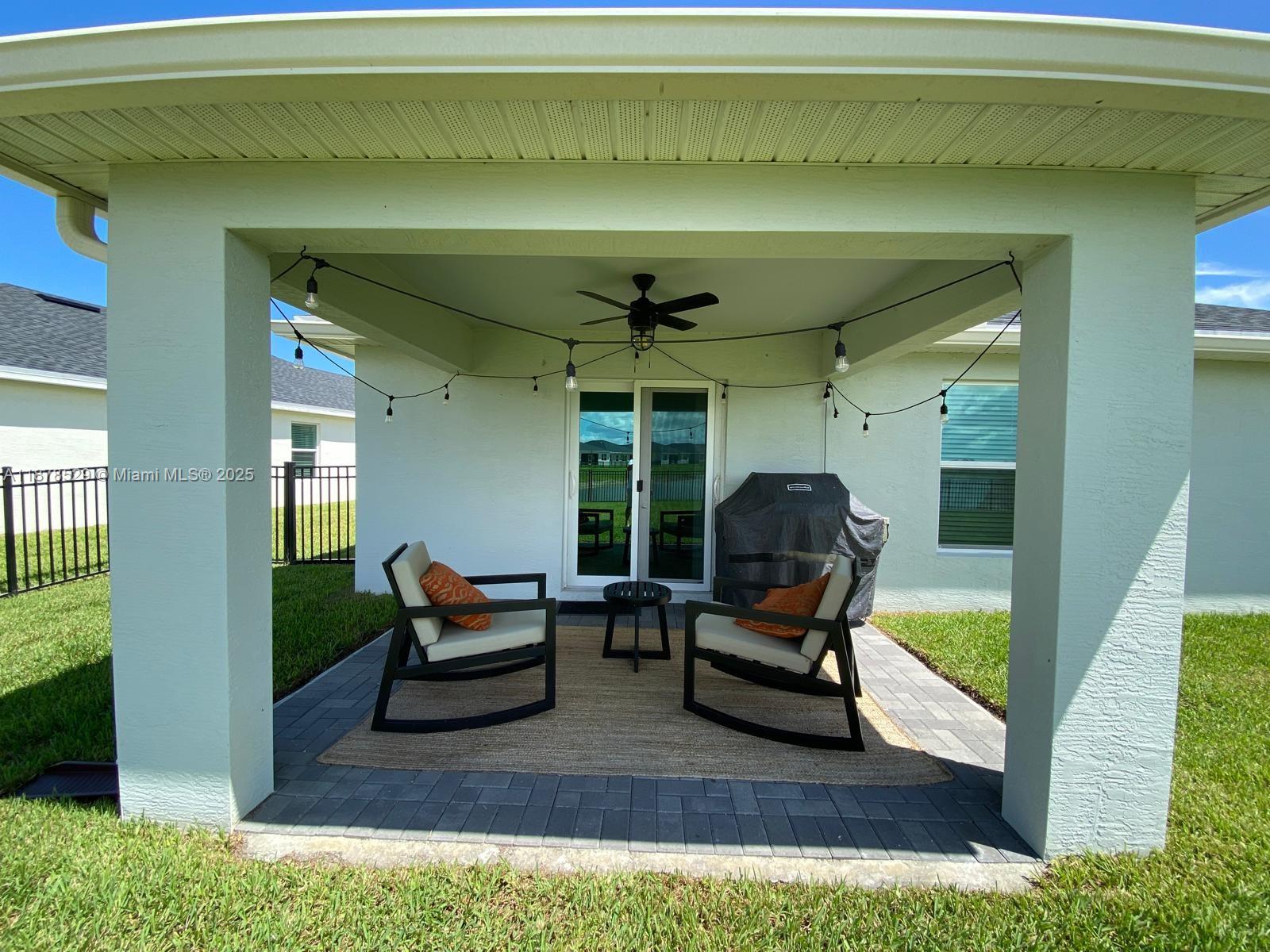11060 Middle Strm Drive Port St. Lucie, FL 34987 - Photo 9 of 41 a living room with furniture and a fireplace