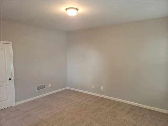 a bathroom with a tub a sink and mirror