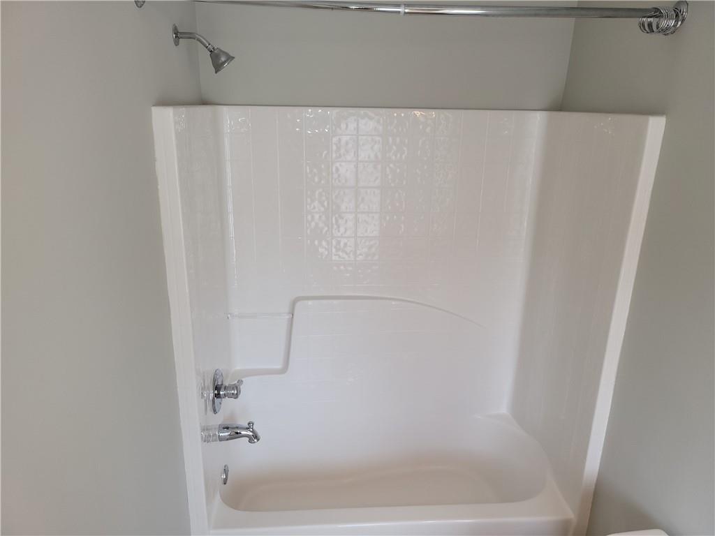 2098 Silas Way Northwest Atlanta, GA 30318 - Photo 15 of 18 a close up of a bathtub
