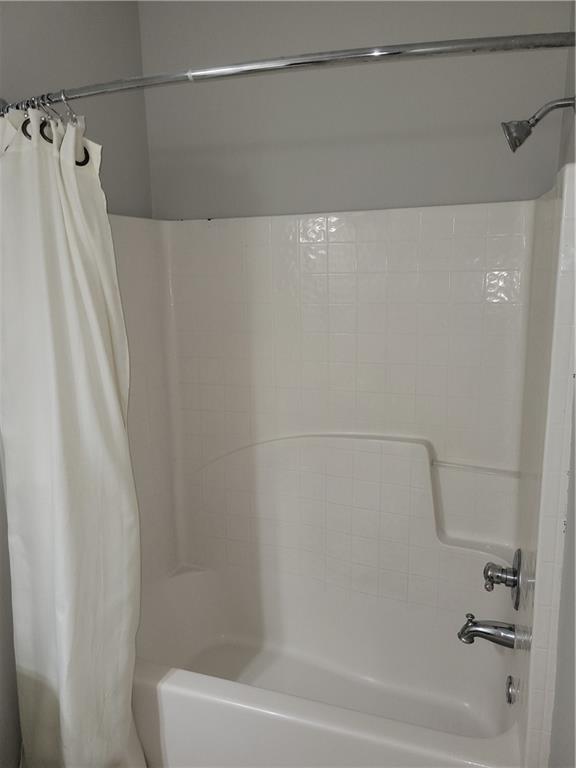 2098 Silas Way Northwest Atlanta, GA 30318 - Photo 16 of 18 a bathroom with a shower and a bath tub