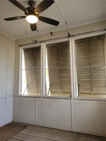 a view of a wooden house with a bench