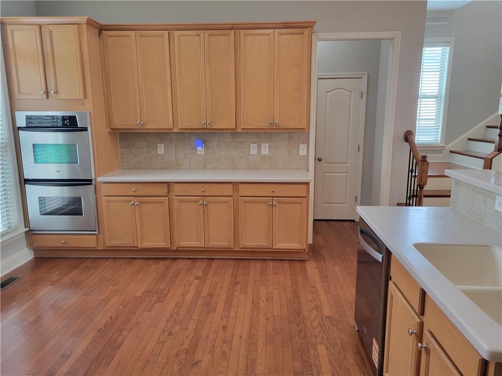 2098 Silas Way Northwest Atlanta, GA 30318 - Photo 4 of 18 a kitchen with stainless steel appliances granite countertop a refrigerator sink and cabinets