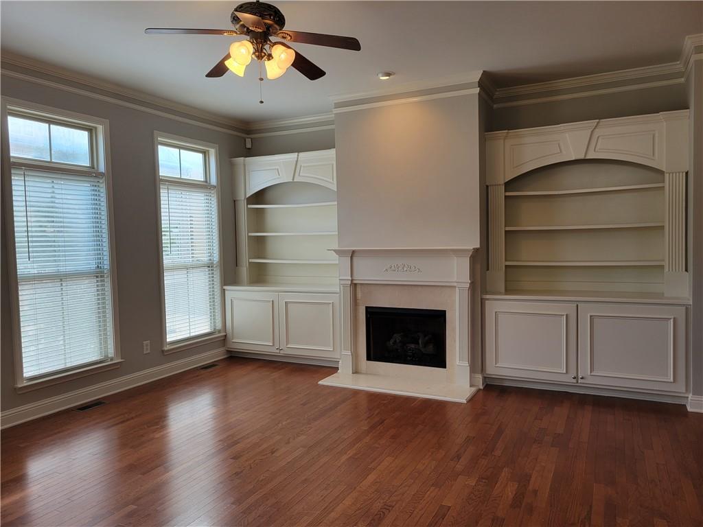 2098 Silas Way Northwest Atlanta, GA 30318 - Photo 7 of 18 a living room with wooden floors and a fireplace