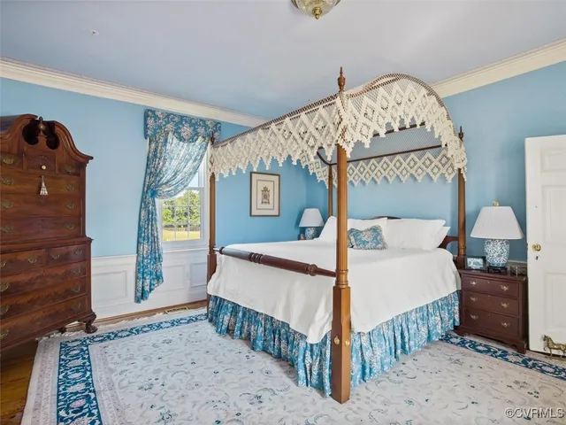 a bedroom with a bed and a mirror