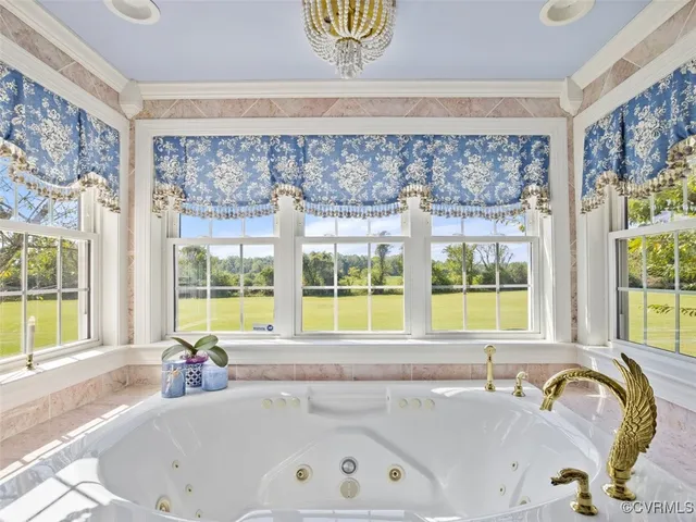a bathroom with a tub and a sink