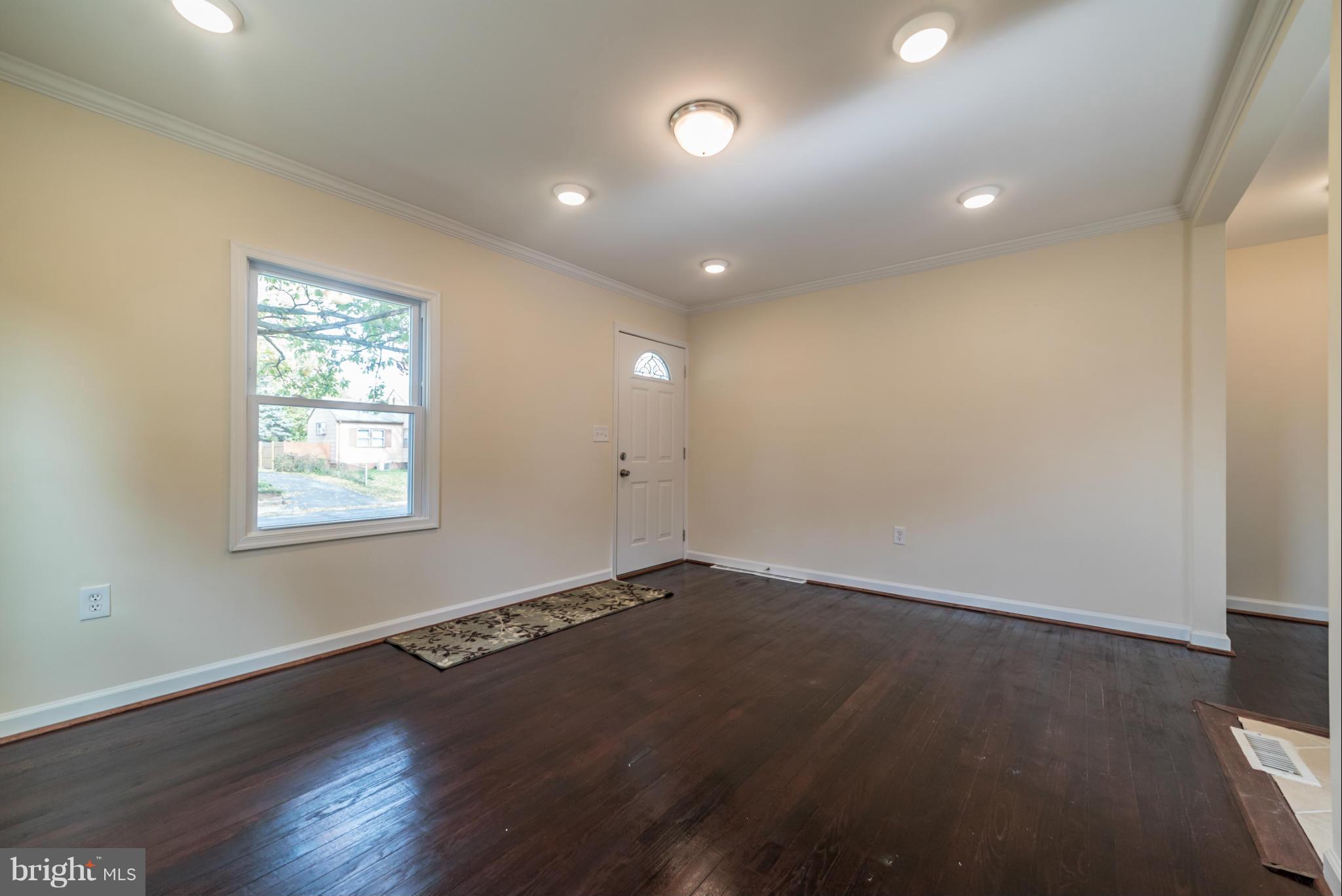 4106 Sampson Road Silver Spring, MD 20906 - Photo 13 of 30 an empty room with wooden floor and windows