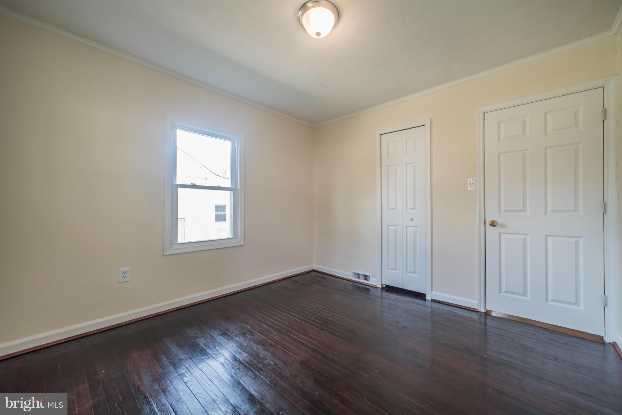 4106 Sampson Road Silver Spring, MD 20906 - Photo 15 of 30 an empty room with wooden floor and windows
