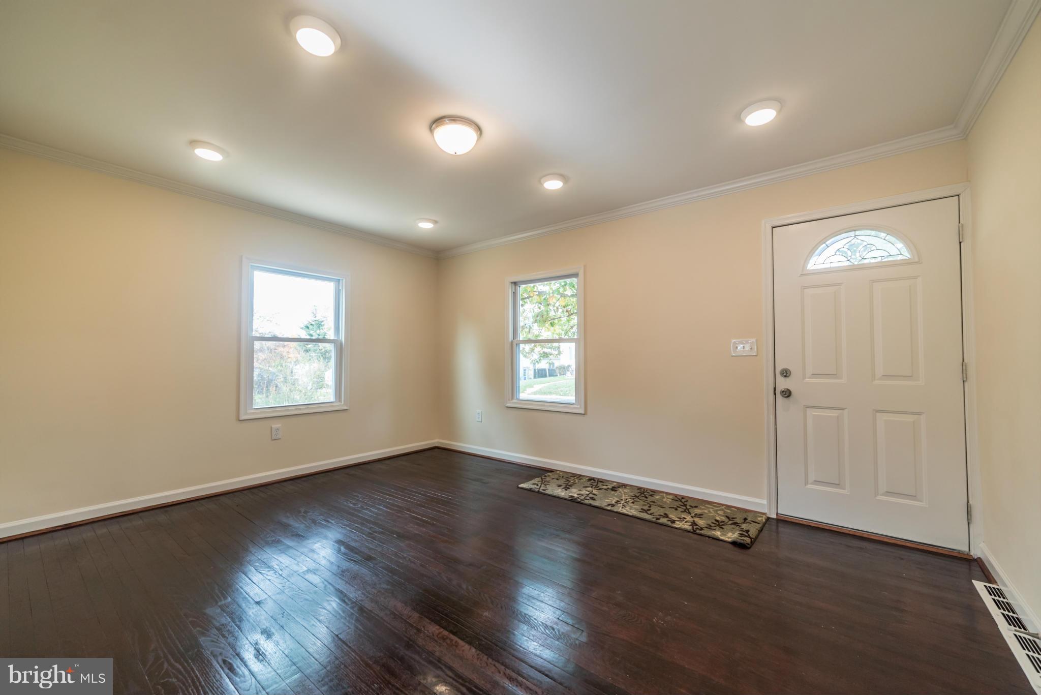 4106 Sampson Road Silver Spring, MD 20906 - Photo 10 of 30 an empty room with wooden floor and windows