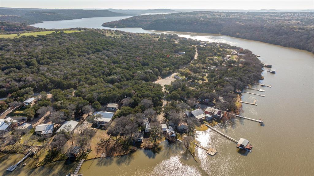 9037 Lacy Road Graford, TX 76449 - Photo 16 of 36 a view of a lake in middle of a town