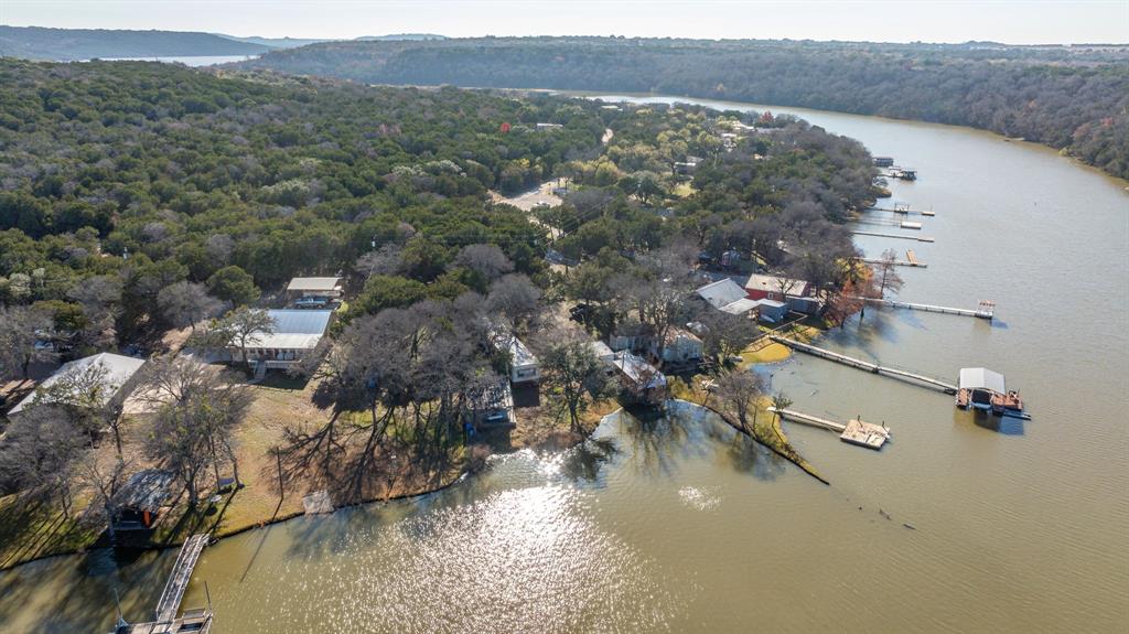 9037 Lacy Road Graford, TX 76449 - Photo 17 of 36 a view of a lake in middle of the town