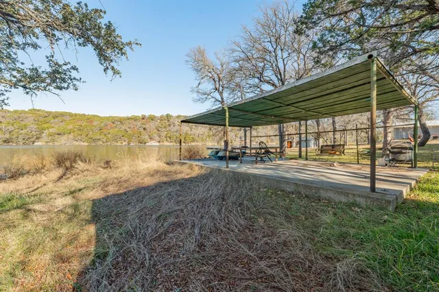 a view of a backyard of the house