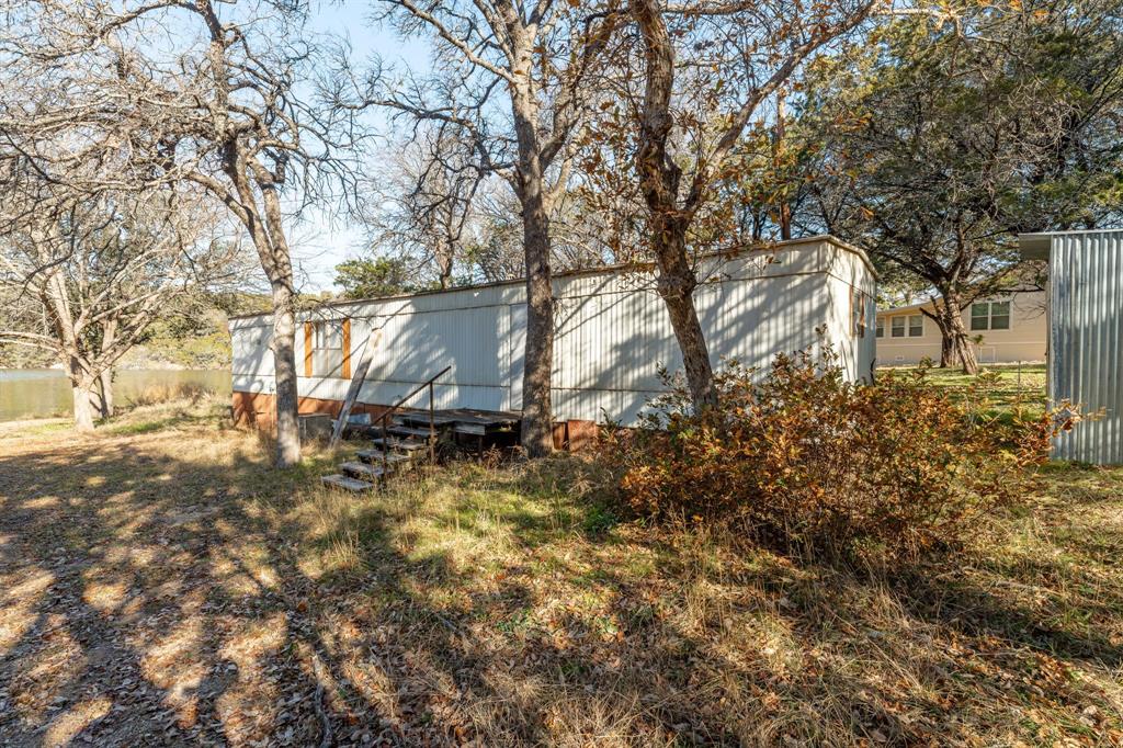 9037 Lacy Road Graford, TX 76449 - Photo 30 of 36 a view of outdoor space and yard