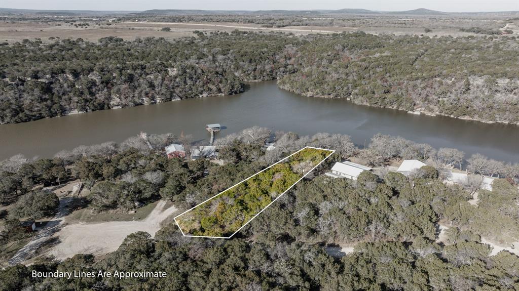 9037 Lacy Road Graford, TX 76449 - Photo 35 of 36 an aerial view of a house with a yard and lake view