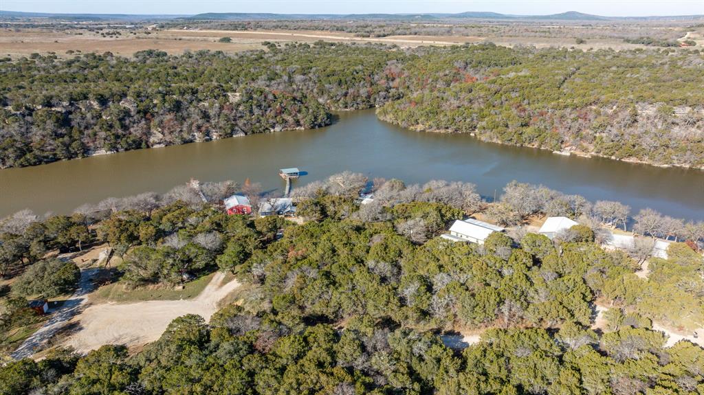 9037 Lacy Road Graford, TX 76449 - Photo 4 of 36 an aerial view of a houses with a lake view