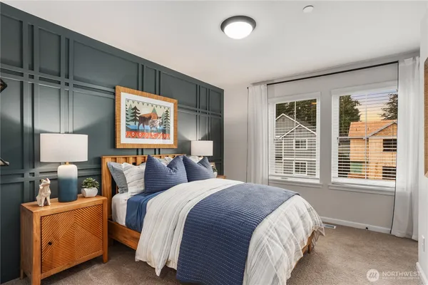 a bed room with a bed and a night stand