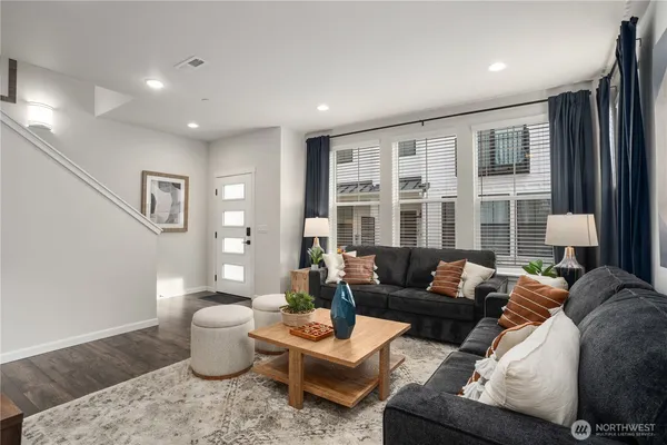 a living room with furniture and a window