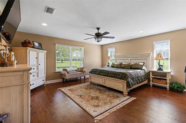 a bedroom with a bed and a couch