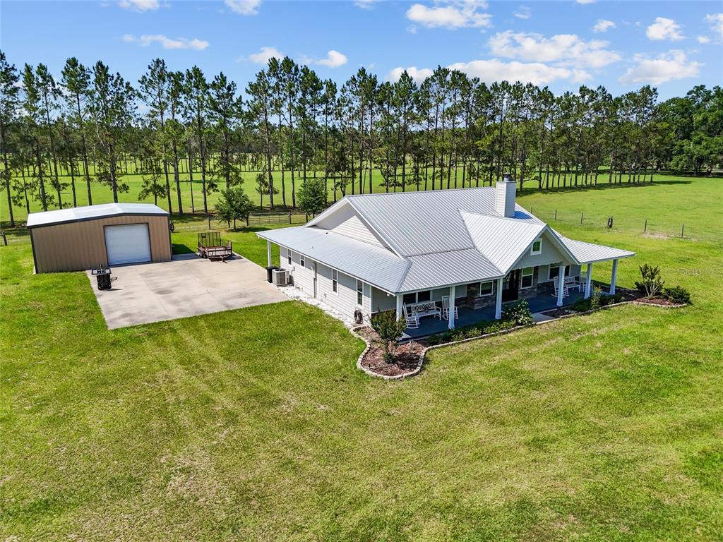 4639 Southwest Wilson Springs Road Fort White, FL 32038 - Photo 22 of 36 an aerial view of a house with garden space and street view