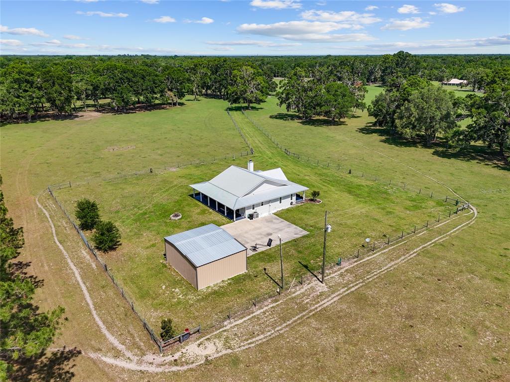 4639 Southwest Wilson Springs Road Fort White, FL 32038 - Photo 26 of 36 a view of a lake with a yard