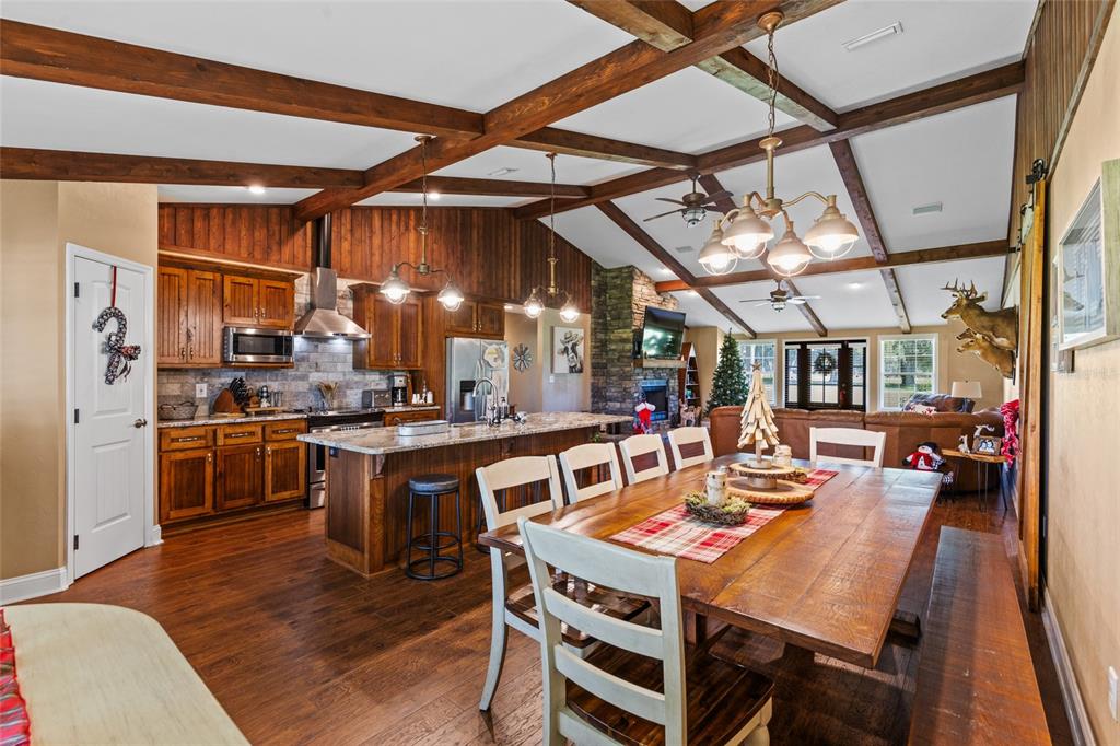 4639 Southwest Wilson Springs Road Fort White, FL 32038 - Photo 5 of 36 a view of a dining room with furniture window and wooden floor