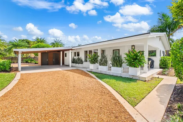 a view of house with swimming pool yard and outdoor seating