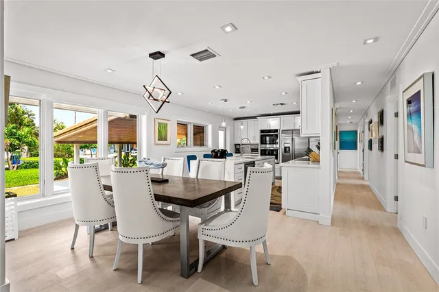 a dining room with furniture and window