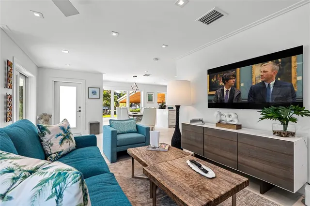 a living room with furniture and a flat screen tv