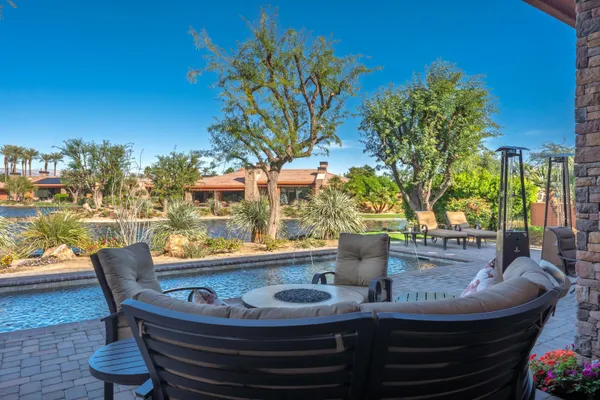 a view of an outdoor dining space with furniture