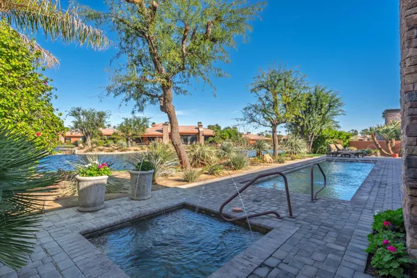 a view of a backyard with sitting area