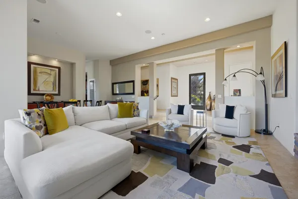 a living room with furniture and a large window