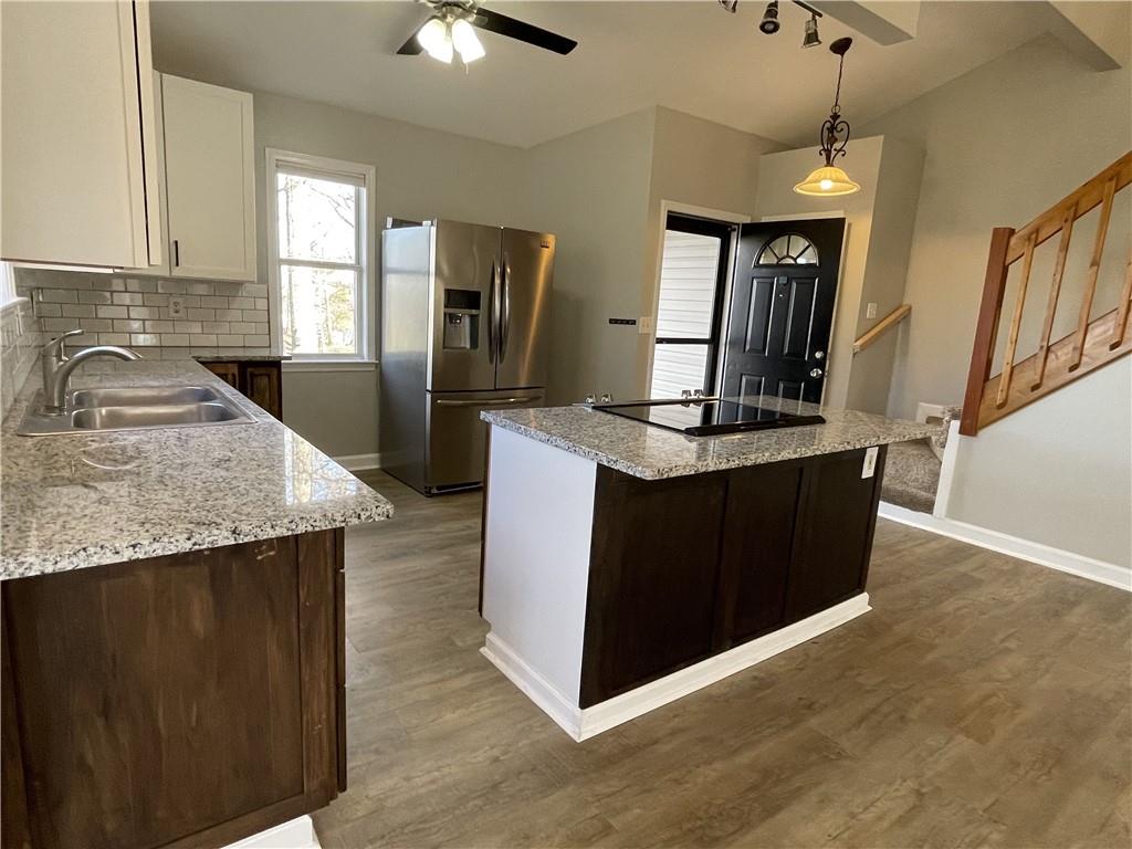 3492 Point View Circle Gainesville, GA 30506 - Photo 11 of 67 a kitchen with kitchen island granite countertop a sink a counter top space and stainless steel appliances