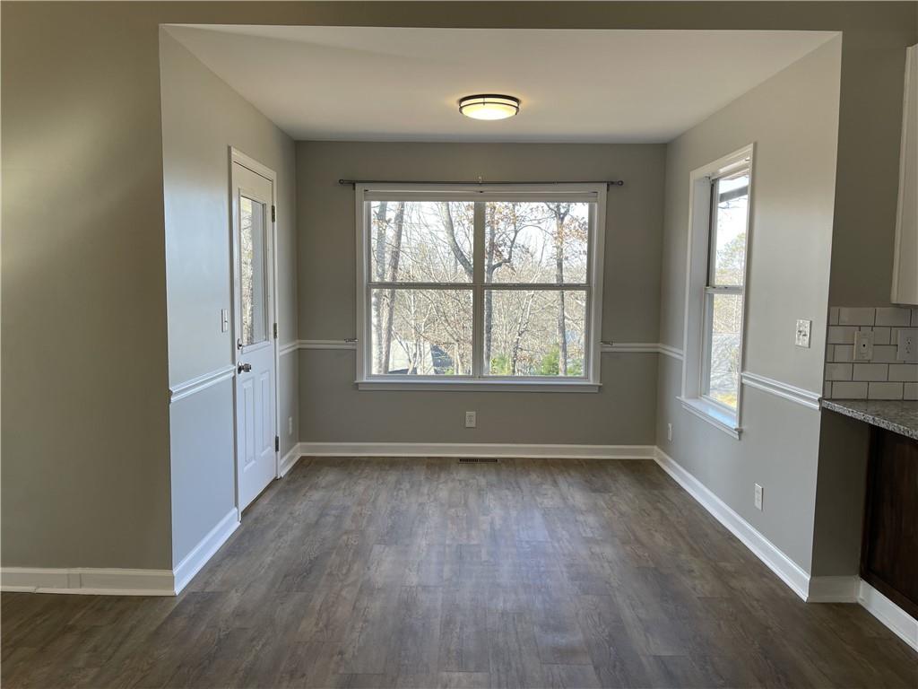 3492 Point View Circle Gainesville, GA 30506 - Photo 13 of 67 an empty room with wooden floor and windows
