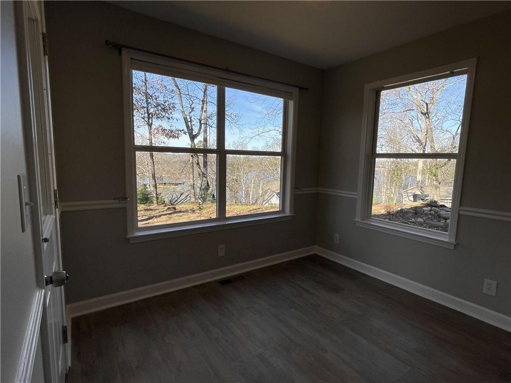 3492 Point View Circle Gainesville, GA 30506 - Photo 14 of 67 a view of an empty room with wooden floor and a window