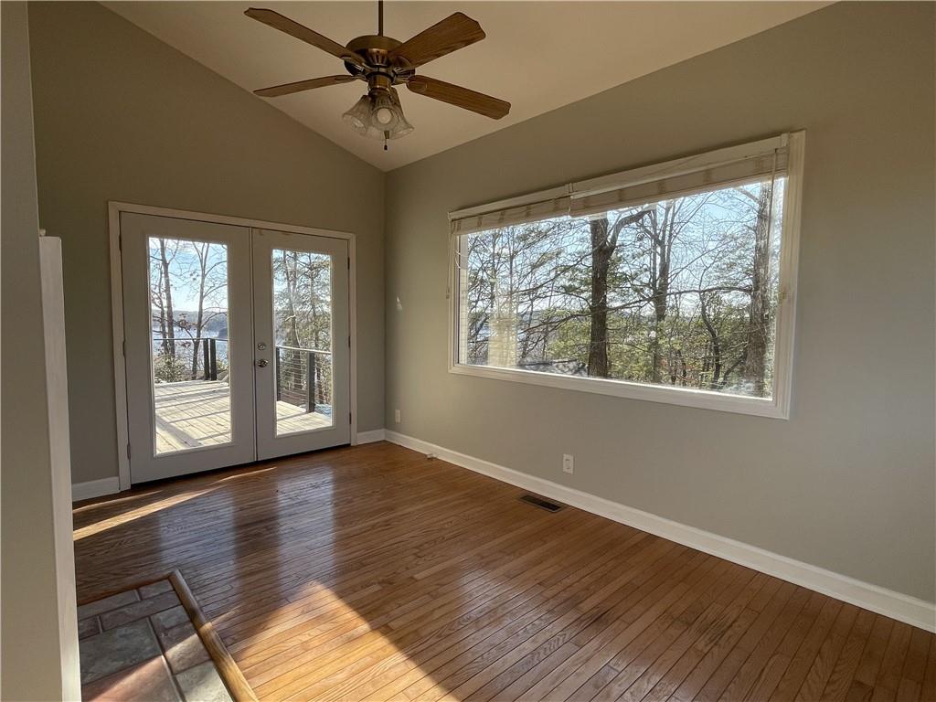 3492 Point View Circle Gainesville, GA 30506 - Photo 21 of 67 a view of an empty room with wooden floor and a window