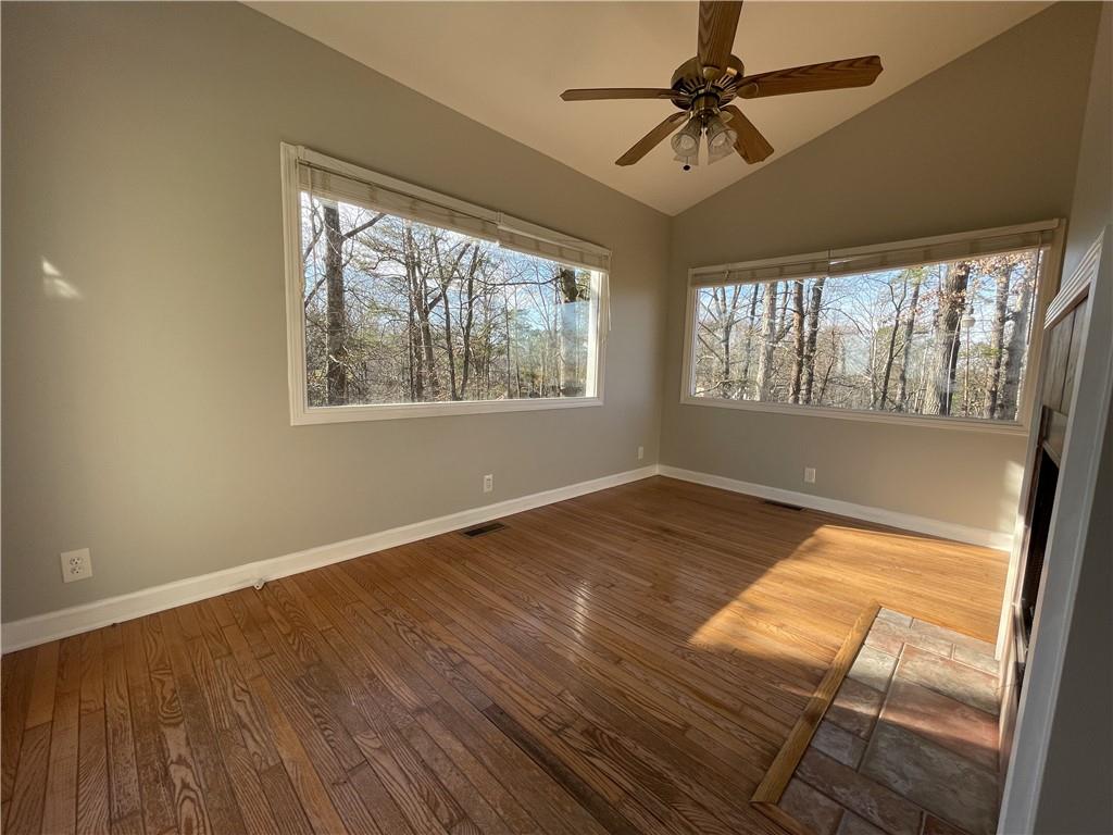 3492 Point View Circle Gainesville, GA 30506 - Photo 22 of 67 a view of an empty room and window and wooden floor