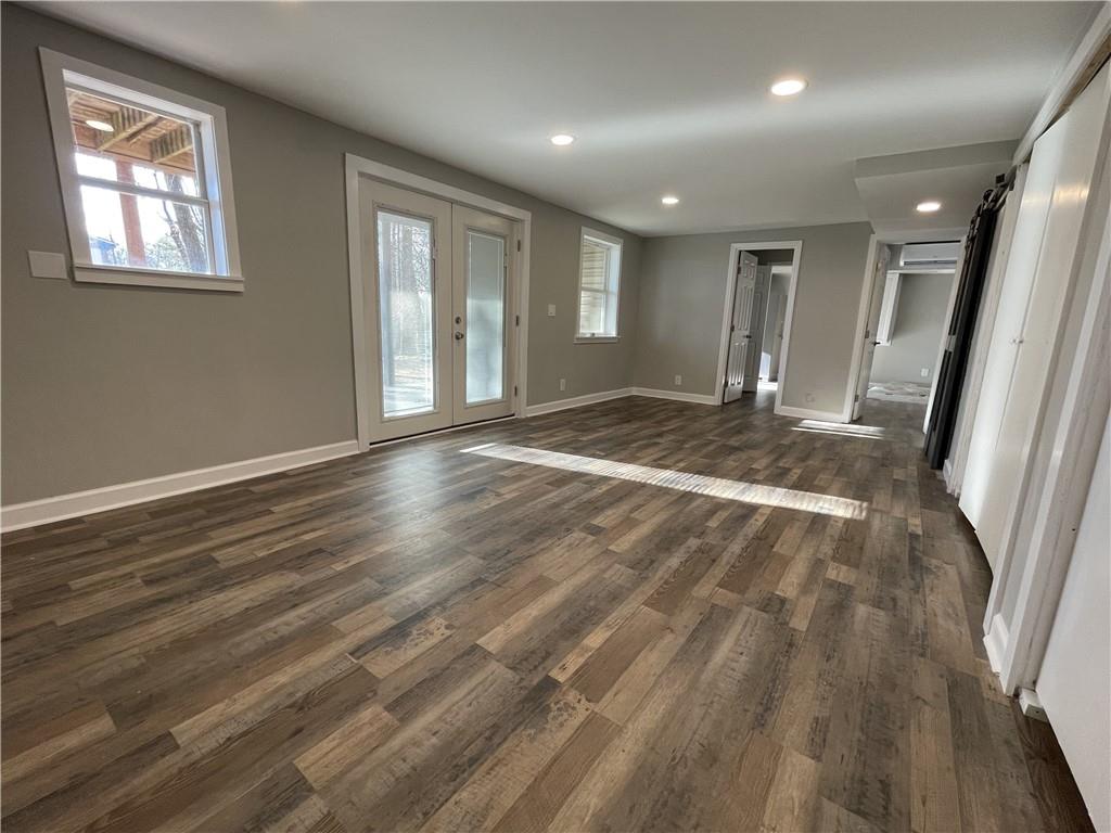 3492 Point View Circle Gainesville, GA 30506 - Photo 51 of 67 a view of an empty room with wooden floor and a window