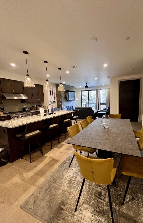 52 6th Street, Unit A4 Silverthorne, CO 80498 - Photo 3 of 15 a large kitchen with a counter top space and stainless steel appliances