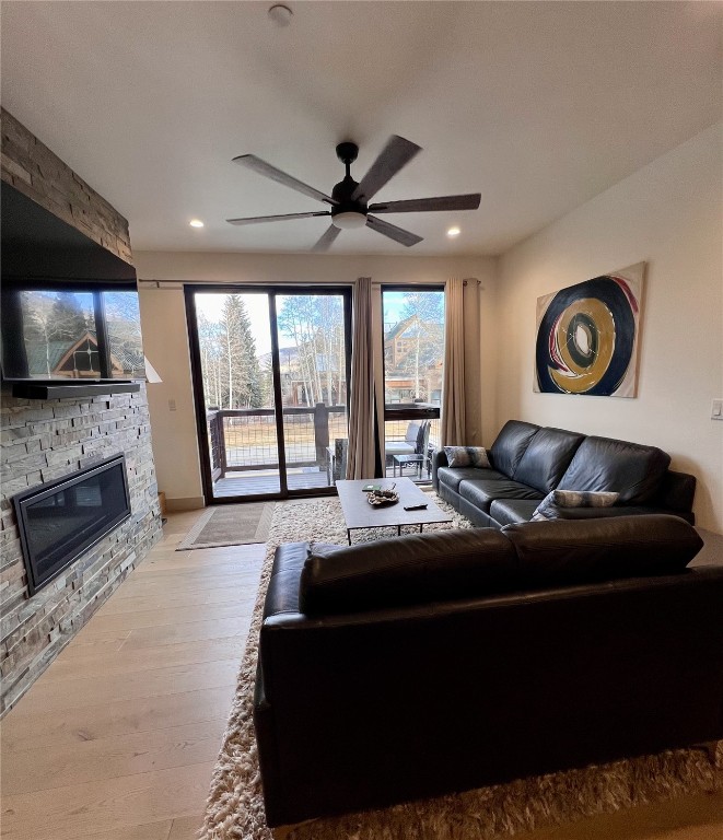 52 6th Street, Unit A4 Silverthorne, CO 80498 - Photo 4 of 15 a living room with fireplace furniture and a flat screen tv