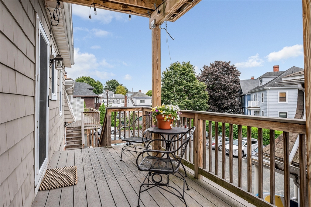 499 Humphrey Street, Unit 3 Swampscott, MA 01907 - Photo 21 of 27 a view of a balcony with chairs