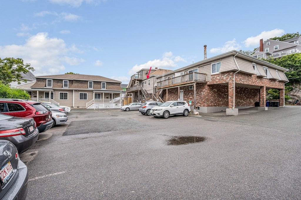 499 Humphrey Street, Unit 3 Swampscott, MA 01907 - Photo 24 of 27 a car parked in front of house