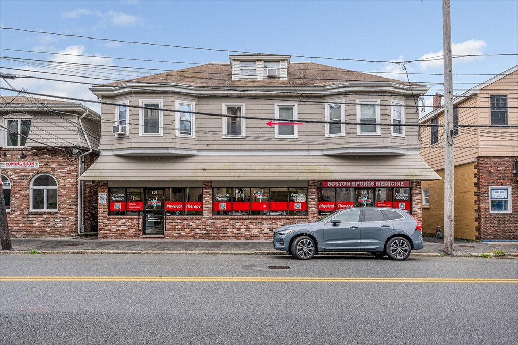 499 Humphrey Street, Unit 3 Swampscott, MA 01907 - Photo 25 of 27 a view of a cars park in front of a building