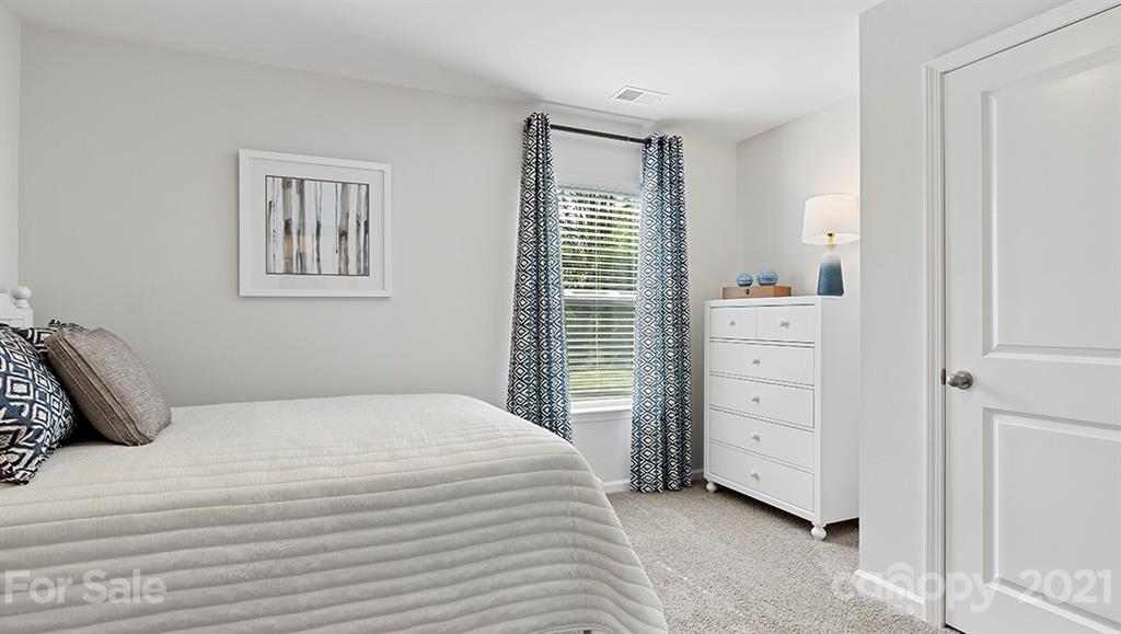 312 Gaines Road Clover, SC 29710 - Photo 16 of 32 a bedroom with a bed and a window