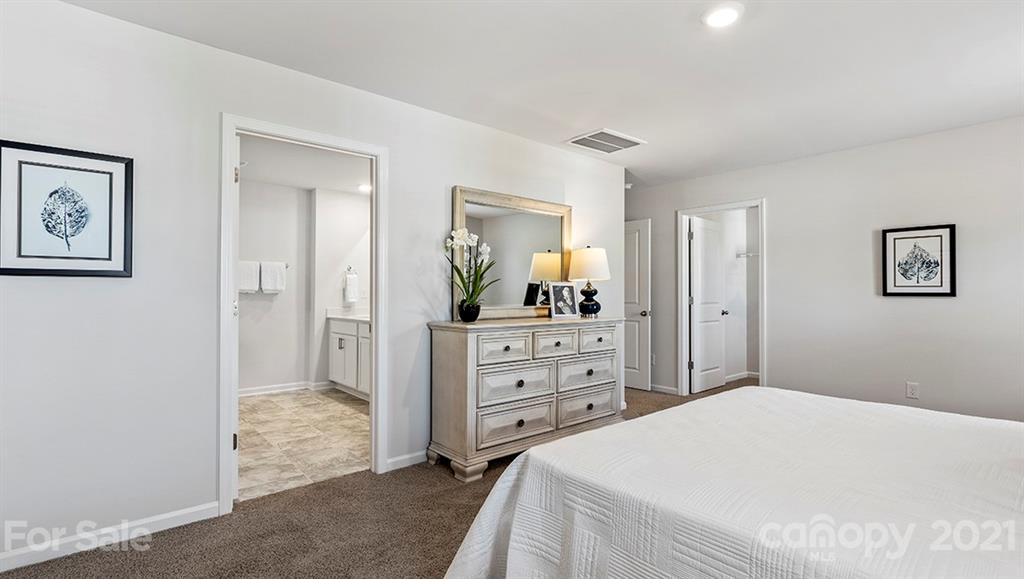 312 Gaines Road Clover, SC 29710 - Photo 21 of 32 a bedroom with a bed and a mirror