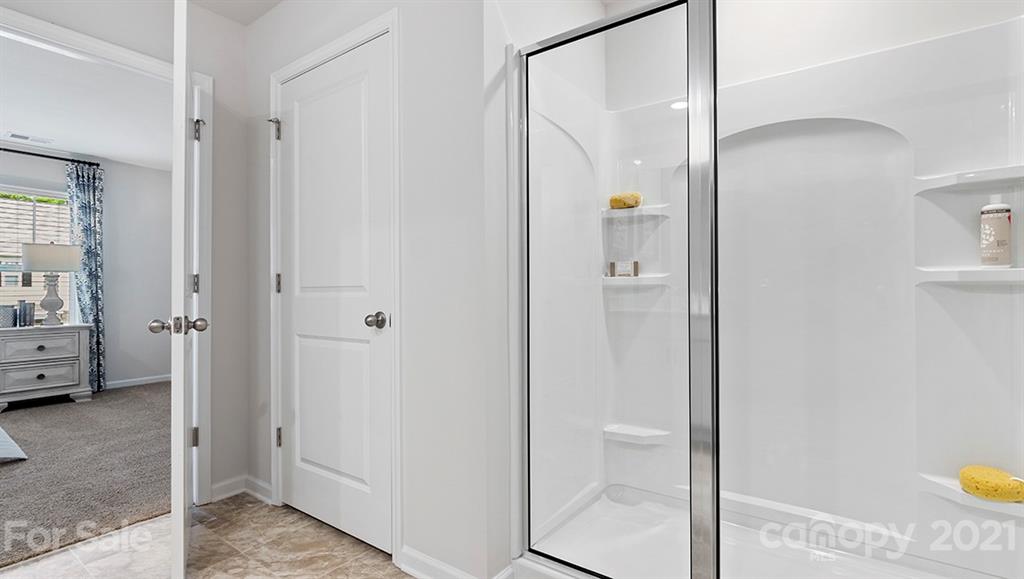 312 Gaines Road Clover, SC 29710 - Photo 24 of 32 a view of a bathroom with sink shower and mirror