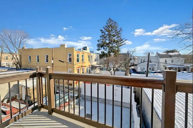 a view of a balcony with a potted plant