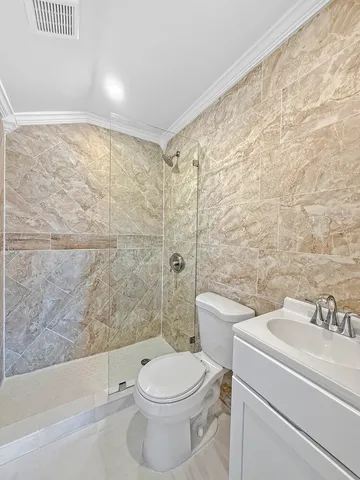 a bathroom with a toilet a sink and bathtub