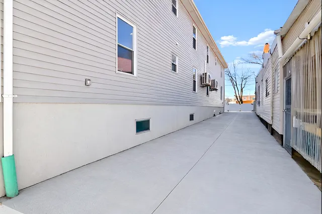 a view of a house with a street